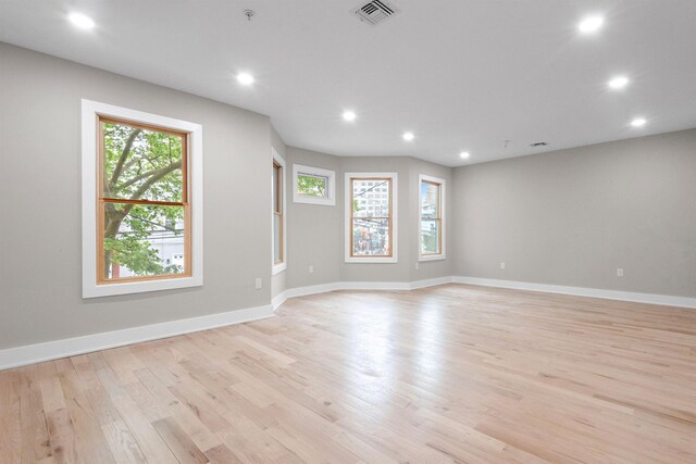 211 Summit Ave Unit 2, Jersey City, NJ 07304 - spare room with plenty of natural light, recessed lighting, light wood-style flooring, and fire sprinkler in ceiling
