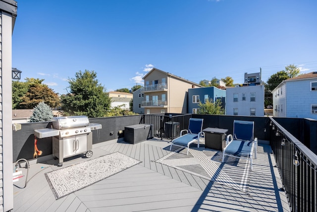 deck featuring a grill