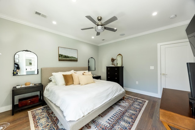 bedroom featuring ceiling fan, dark hardwood / wood-style flooring, and ornamental molding