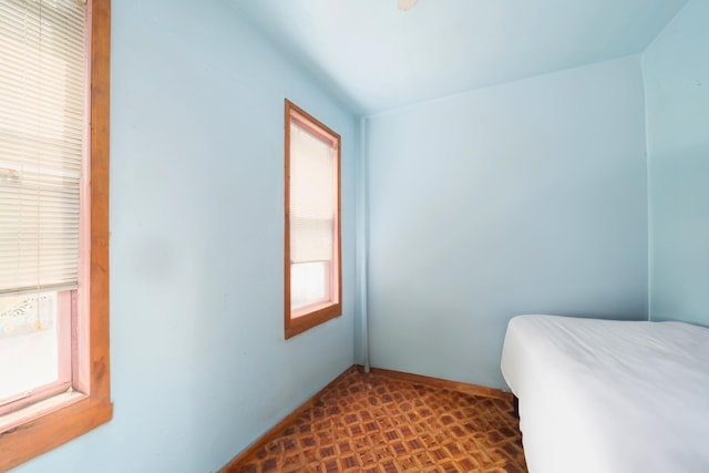 bedroom featuring baseboards