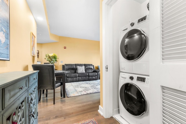 3312 Hudson Ave Unit 3L, Union City, NJ 07087 - laundry room with stacked washing machine and dryer and wood finished floors
