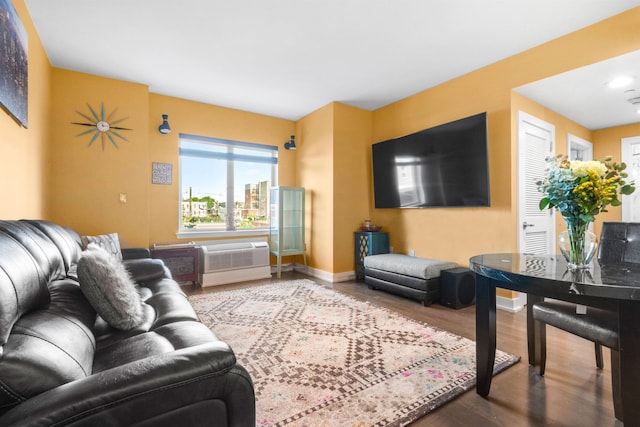 3312 Hudson Ave Unit 3L, Union City, NJ 07087 - living area featuring wood finished floors and an AC wall unit