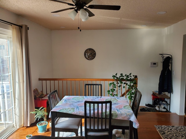 dining space with a textured ceiling