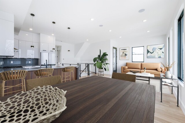 33 Suburbia Ct Unit A, Jersey City, NJ 07305 - dining area with light wood-style flooring and recessed lighting