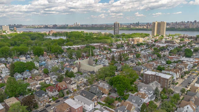 aerial overview of property's location with nearby urban area, a large body of water, and a notable bridge