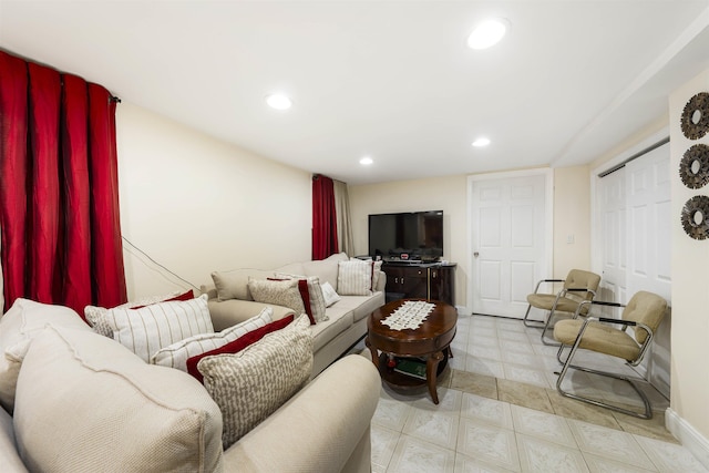 living area with recessed lighting and baseboards