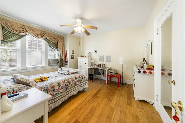 bedroom with light wood finished floors and a ceiling fan