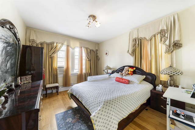 bedroom featuring light wood-style floors