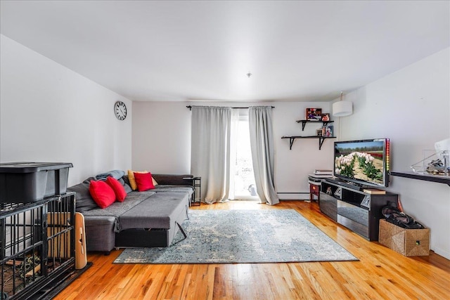 55 71st St, Guttenberg, NJ 07093 - living room with baseboard heating and wood finished floors