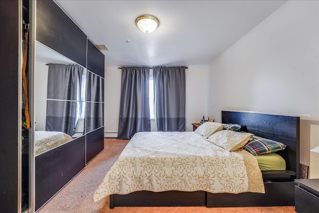 55 71st St, Guttenberg, NJ 07093 - bedroom featuring carpet floors and a baseboard heating unit