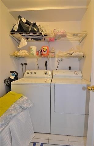 55 71st St, Guttenberg, NJ 07093 - laundry room with washing machine and dryer and light tile patterned floors
