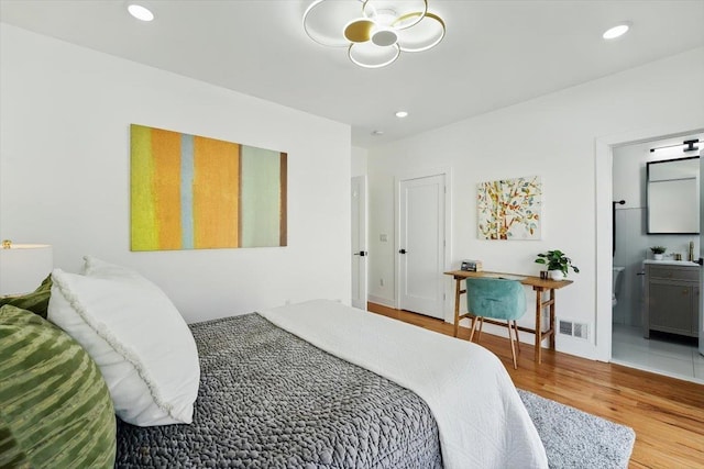 54 Logan Ave Unit 1, Jersey City, NJ 07306 - bedroom featuring wood finished floors, recessed lighting, and ensuite bath