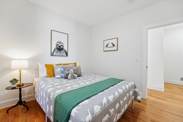 54 Logan Ave Unit 1, Jersey City, NJ 07306 - bedroom with baseboards and wood finished floors