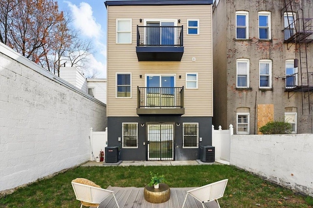54 Logan Ave Unit 1, Jersey City, NJ 07306 - back of house with a balcony, central AC unit, and stucco siding