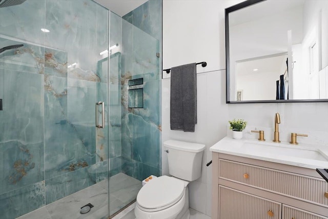 54 Logan Ave Unit 1, Jersey City, NJ 07306 - bathroom featuring toilet, a marble finish shower, and vanity