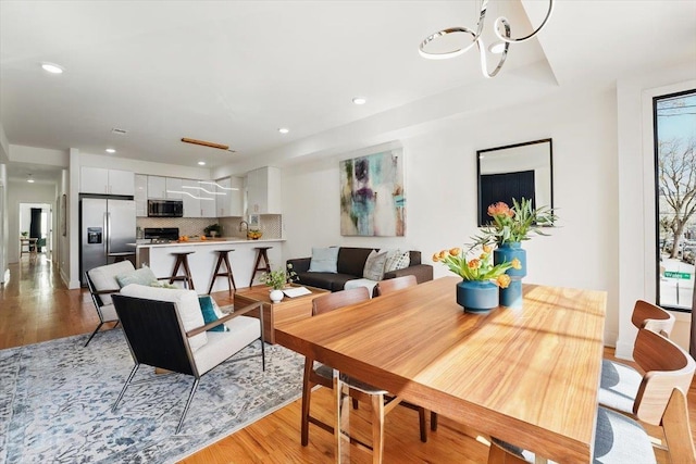 54 Logan Ave Unit 1, Jersey City, NJ 07306 - dining room with light wood-style floors, a chandelier, and recessed lighting