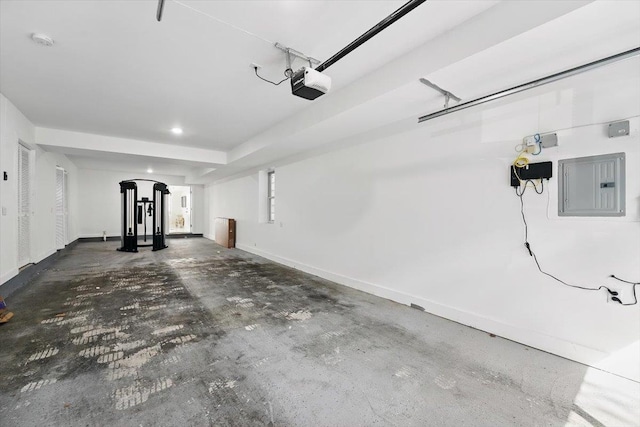 54 Logan Ave Unit 1, Jersey City, NJ 07306 - garage with electric panel, a garage door opener, baseboards, and recessed lighting