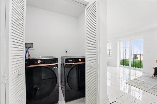 54 Logan Ave Unit 1, Jersey City, NJ 07306 - washroom with independent washer and dryer and light tile patterned floors