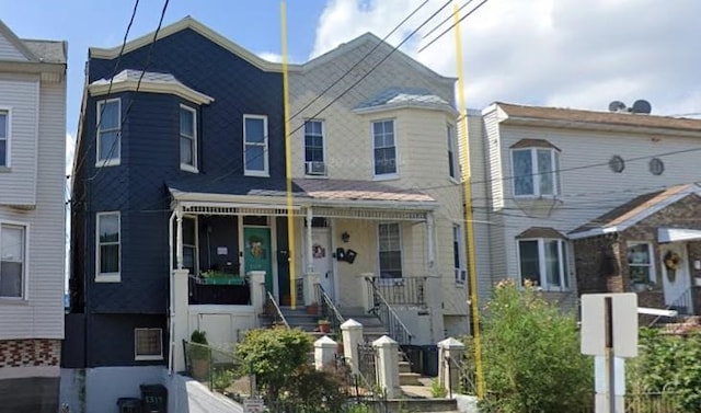 view of property with covered porch