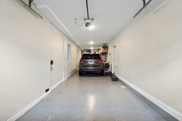 1163 Summit Ave Unit 1, Jersey City, NJ 07307 - garage featuring baseboards and a garage door opener