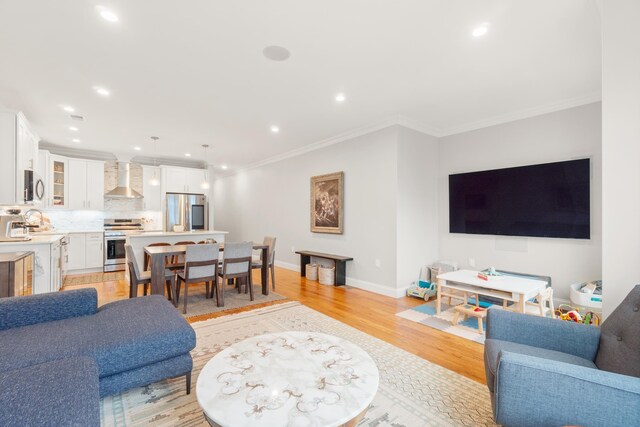 1163 Summit Ave Unit 1, Jersey City, NJ 07307 - living room with light wood-style floors, recessed lighting, and crown molding