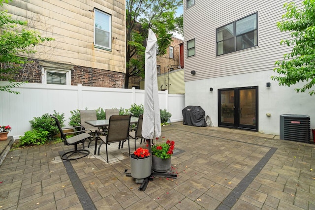 1163 Summit Ave Unit 1, Jersey City, NJ 07307 - fenced backyard with french doors, a patio area, and outdoor dining space