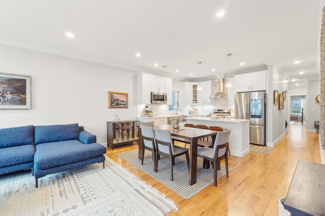 1163 Summit Ave Unit 1, Jersey City, NJ 07307 - dining room with light wood-style floors, crown molding, and recessed lighting