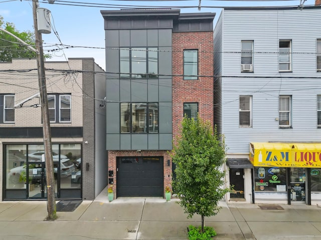 1163 Summit Ave Unit 1, Jersey City, NJ 07307 - view of property with concrete driveway and an attached garage