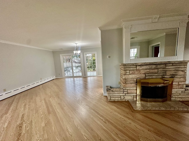 unfurnished living room with a textured ceiling, crown molding, a baseboard radiator, a chandelier, and hardwood / wood-style floors