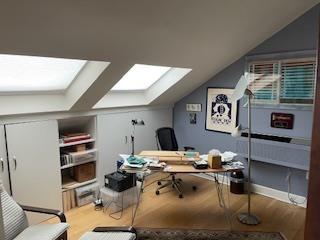 office featuring vaulted ceiling and wood finished floors