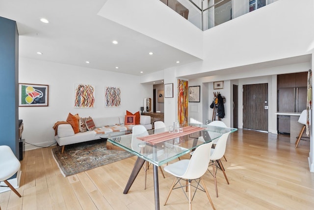 dining area with recessed lighting and light wood finished floors