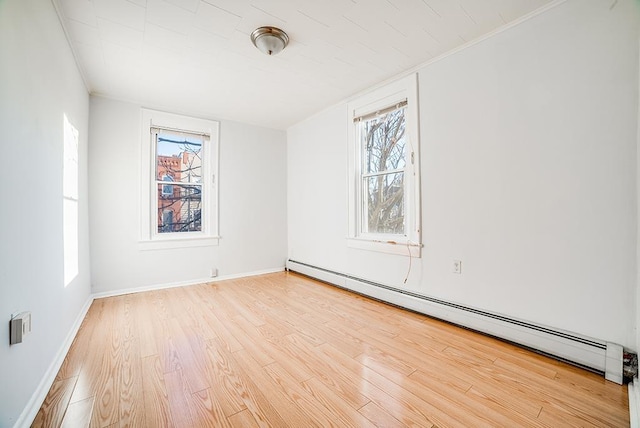1043 Broadway, Bayonne, NJ 07002 - unfurnished room featuring baseboard heating, wood finished floors, and baseboards