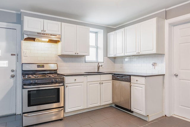 1043 Broadway, Bayonne, NJ 07002 - kitchen with stainless steel appliances, under cabinet range hood, a sink, white cabinetry, and ornamental molding