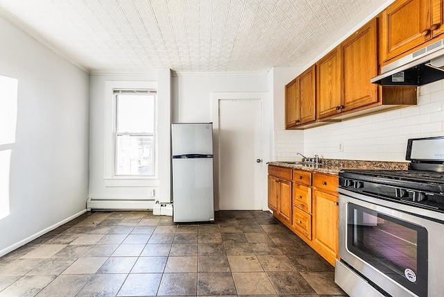 1043 Broadway, Bayonne, NJ 07002 - kitchen with appliances with stainless steel finishes, under cabinet range hood, brown cabinets, decorative backsplash, and a sink