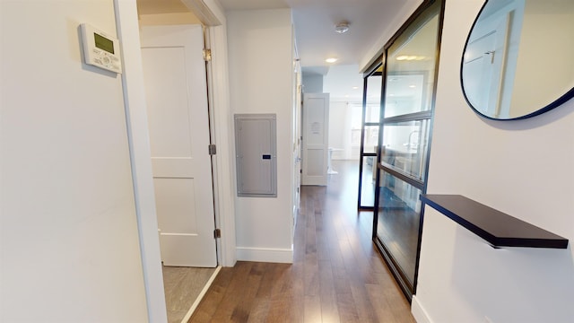 corridor with wood-type flooring