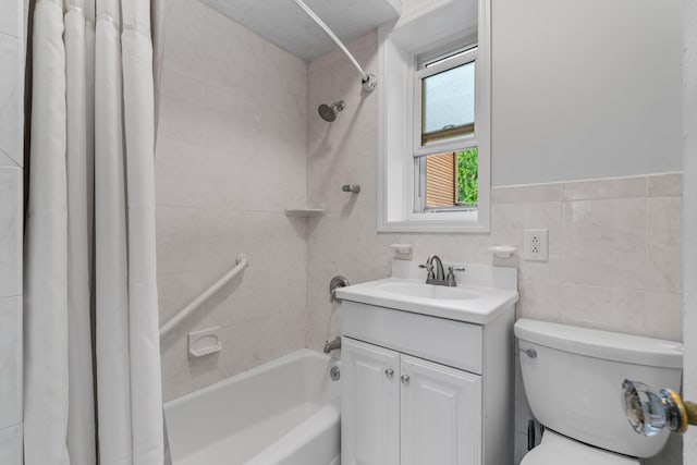 122 W 39th St Unit A4, Bayonne, NJ 07302 - bathroom with shower / bath combo, vanity, and tile walls