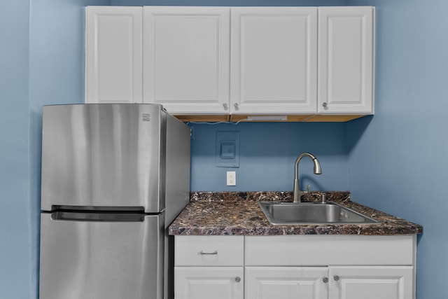 122 W 39th St Unit A4, Bayonne, NJ 07302 - kitchen featuring freestanding refrigerator, white cabinetry, and dark stone counters