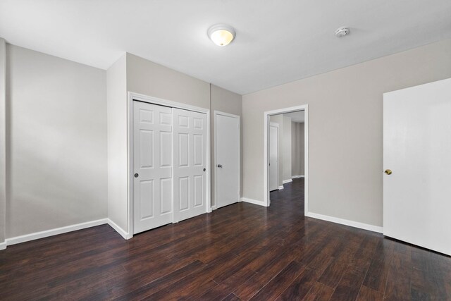 37 Pearsall Ave, Jersey City, NJ 07305 - unfurnished bedroom with wood finished floors, baseboards, and a closet