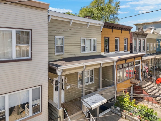 37 Pearsall Ave, Jersey City, NJ 07305 - rear view of house featuring a chimney