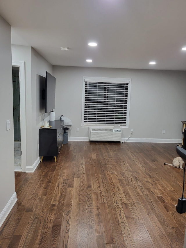 living room with dark hardwood / wood-style flooring