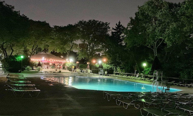 602 Sanderling Ct Unit 602, Secaucus, NJ 07094 - pool at twilight featuring a patio area and a community pool