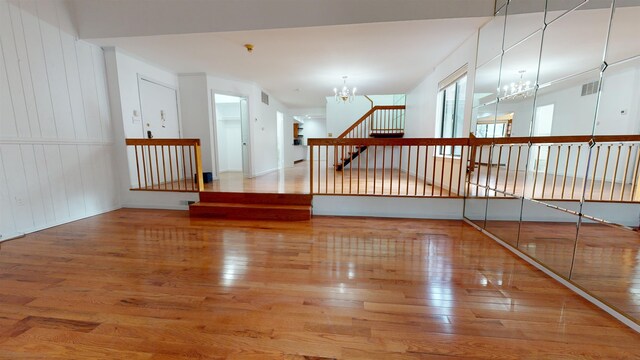 602 Sanderling Ct Unit 602, Secaucus, NJ 07094 - unfurnished room with a chandelier, wood finished floors, and stairway