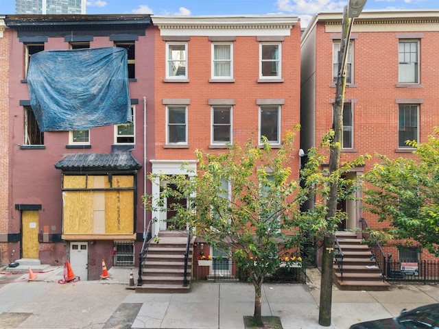 227 Montgomery St Unit 2, Jersey City, NJ 07302 - view of front of property with brick siding and stairway