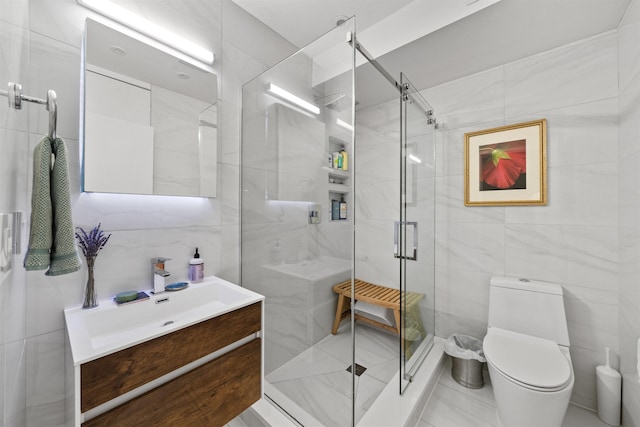 227 Montgomery St Unit 2, Jersey City, NJ 07302 - bathroom featuring tile walls, vanity, and a shower stall