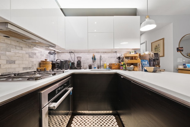227 Montgomery St Unit 2, Jersey City, NJ 07302 - kitchen featuring stainless steel appliances, modern cabinets, light countertops, white cabinets, and backsplash