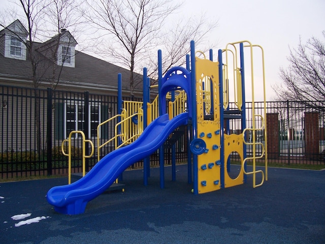 communal playground featuring fence