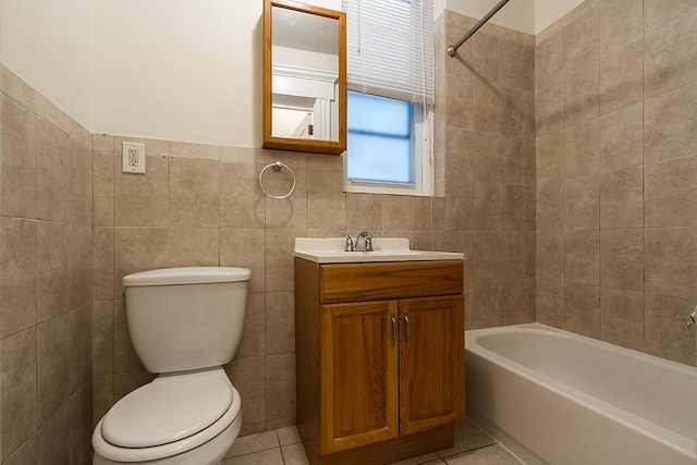 full bath with a tub to relax in, tile patterned flooring, tile walls, and toilet