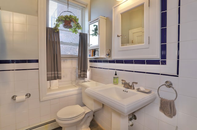 329 Adams St Unit 4, Hoboken, NJ 07030 - bathroom featuring decorative backsplash, baseboard heating, toilet, and tile walls