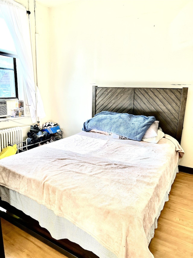500 New York Ave, Jersey City, NJ 07087 - bedroom featuring wood finished floors and radiator