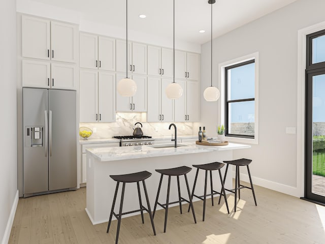 kitchen featuring stainless steel refrigerator with ice dispenser, white cabinetry, sink, and light stone counters